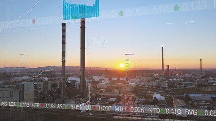  Industrial Oil refinery plant with sunset in background and Wall Street Stock Market graphic....