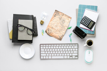 Composition with modern computer keyboard, mouse, cup of coffee, world map and stationery on white background