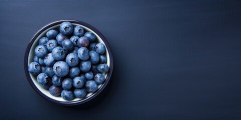 Bowl Full of Blueberry on Dark Blue Background. Healthy Food. Ripe of Wild Berries. Generative AI - Powered by Adobe
