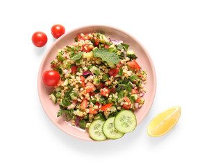 Plate with delicious tabbouleh salad on white background