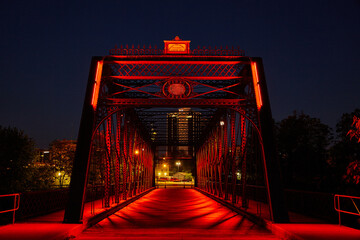Red Illuminated Bridge at Night - Urban Metalwork Perspective