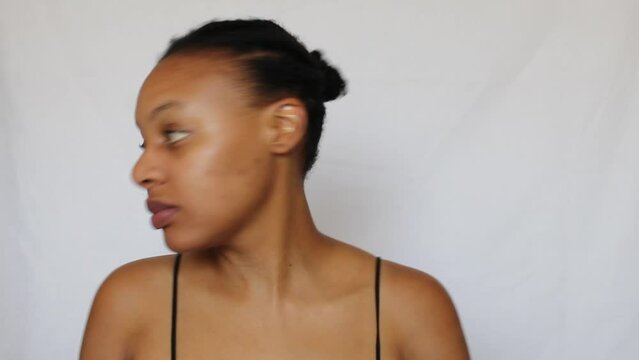 Black woman with her natural 4c hair on a white background
