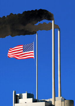 smoking chimneys, dark dirty smoke, a flag of the USA hangs on one of the chimneys like on a flagpole, concept, the original has been heavily modified