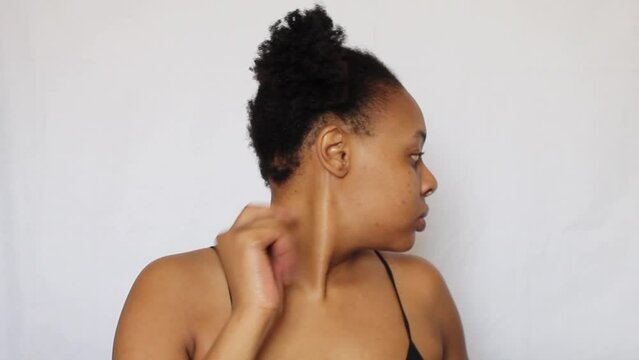 Black woman with her natural 4c hair on a white background