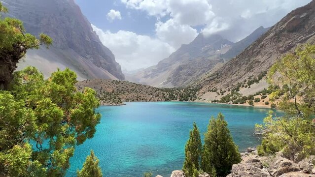 The Alaudin (Chapdara) lakes, lying at an altitude of 2800 m, are considered one of the most beautiful lakes of the Fan Mountains. Turquoise mountain lake. Pamiro-Alai. Tajikistan, Pamir 4K