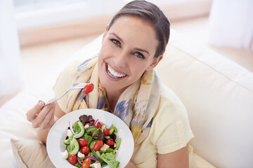 Healthy food, woman in portrait with salad and diet, organic vegetables and relax on sofa with...