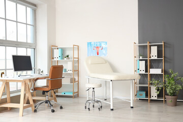 Interior of gynecologist's office with workplace and couch - obrazy, fototapety, plakaty