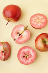 Sweet pink apples on yellow background