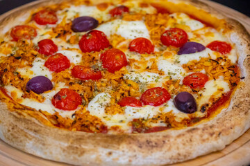 Traditional Brazilian chicken pizza with catupiry cheese, long-aged dough baked on a stone
