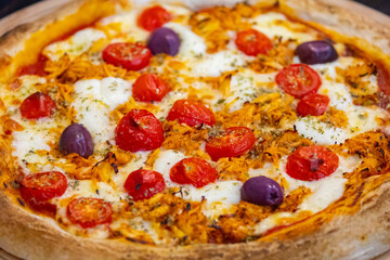 Traditional Brazilian chicken pizza with catupiry cheese, long-aged dough baked on a stone