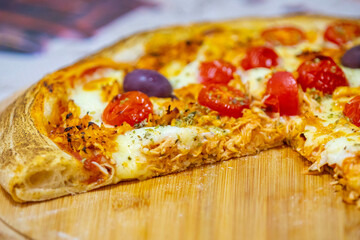 Traditional Brazilian chicken pizza with catupiry cheese, long-aged dough baked on a stone