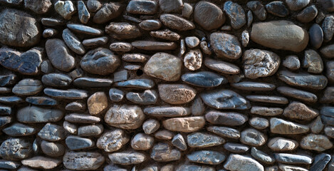 A stone wall pebble rock texture / graphic design resource texture for photo editing or wallpaper /...