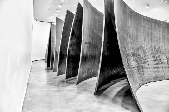 Bilbao, Spain - January 3, 2024: "Matter of Time", 2005 and "Snake (Serpiente)", 1997, Richard Serra, exhibited at the Guggenheim Museum Bilbao, Spain, designed by Frank Gehry.
