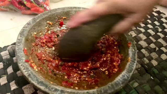 Cooking sambal, mixing and grinding spice and chili pepper