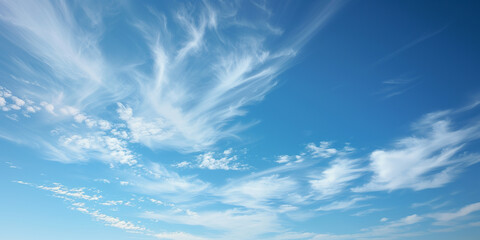 A blue sky with scattered cirrus clouds - obrazy, fototapety, plakaty