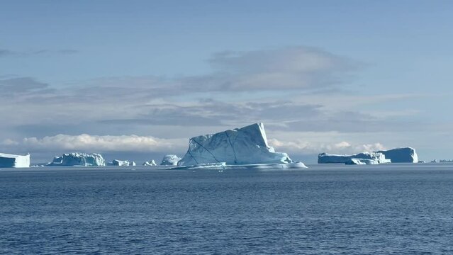 Icebergs floating by in Hall Bredning in Scoresbysund, Greenland.