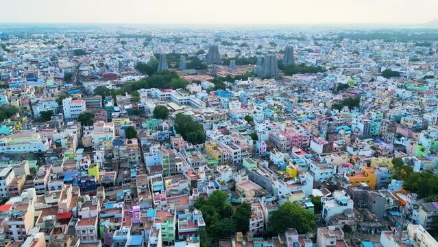 Densely populated Madurai cityscape with diverse architecture at dusk, and aerial view. Tamil Nadu, China