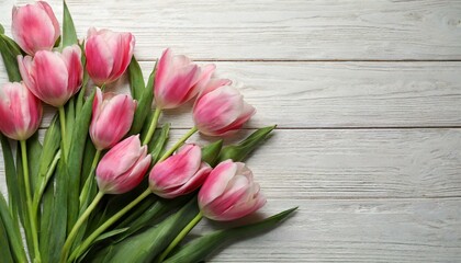 - Beautiful pink spring tulips on white wooden background, flat lay. Space for text