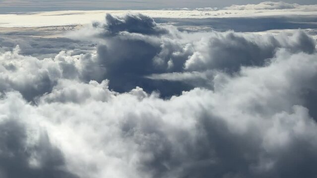 Large Cumulonimbus Clouds; Aerial View Of Mother Nature; Commercial Airplane Pilot Flying Over Severe Weather Conditions.