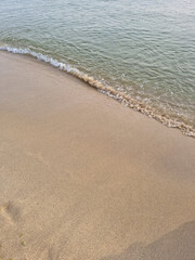 
This is a close-up of the beach sand and waves.