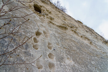 Monk's cave in the rock. Background with selective focus and copy space