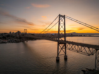 beautiful sunset on the Hercílio Luz bridge, in Florianópolis, Santa Catarina. Overlooking the mainland of the city