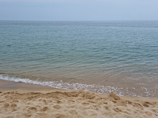 Soft beautiful ocean wave on sandy beach. Beach landscape.