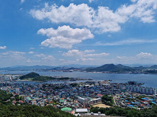 Fototapeta premium This is an aerial shot of downtown Mokpo, with the sea visible in the distance.