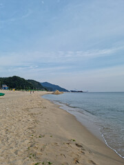 
It is a seascape with a sandy beach.