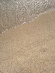 
This is a close-up of the beach sand and waves.