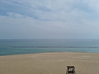 Sea and sandy beach with blue sky