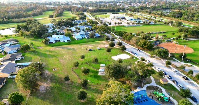 Aerial footage of Vance Harmon Park on a sunny day in Kissimmee city in Osceola, Florida, USA