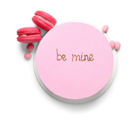 Pink bento cake with macaroons on white background. Valentine's Day celebration