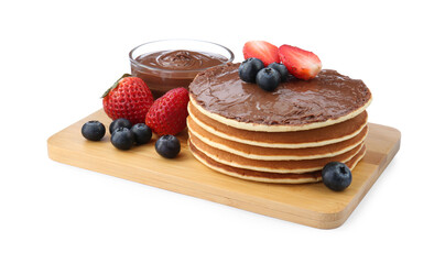 Tasty pancakes with chocolate paste and berries isolated on white