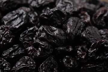 Sweet dried prunes as background, closeup view