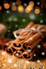 Obraz na płótnie Canvas Different spices, closeup. Cinnamon, anise on brown sugar. Bokeh effect