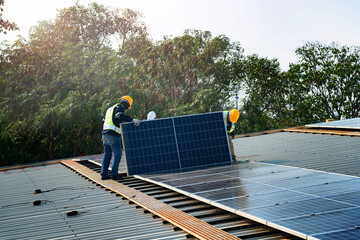 Worker Technicians are working to construct solar panels system on roof. Installing solar...