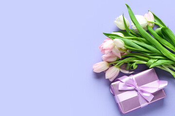 Bouquet of beautiful tulips and gift box on purple background. International Women's Day