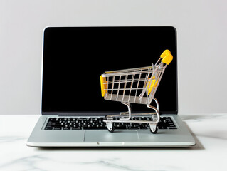 Concept of E-commerce, shopping cart on a laptop, concept of webshop, shopping online