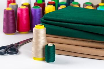 Colored thread spools with fabric for a sewing machine.
