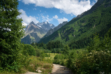 View of the Dombay-Ulgen gorge in the mountains of the North Caucasus and the trail to the...