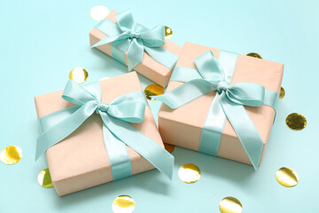 Gift boxes and confetti on blue background. International Women's Day