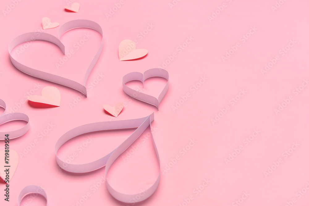 Wall mural composition with paper hearts for valentine's day celebration on pink background, closeup