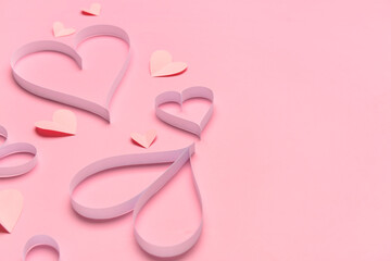 Composition with paper hearts for Valentine's Day celebration on pink background, closeup