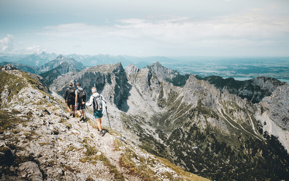 Three hikers at Hochplatte, Ammergauer Alps