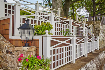 Elegant Garden Fence with Lantern and Blooming Flowers