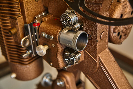Vintage Film Projector Close-Up with Leather Texture and Lens Focus
