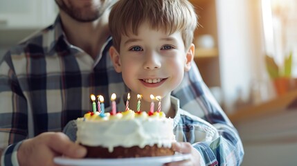 Obraz na płótnie Canvas Cheerful cute boy with father holding birthday cake at home : Generative AI