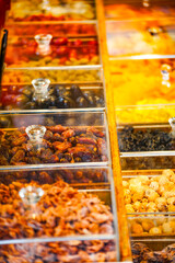 a variety of traditional Chinese medicines displayed in transparent boxes