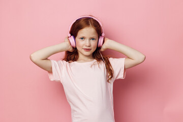 Obraz na płótnie Canvas Enjoy children sound headphones cute music listen girl little childhood entertainment